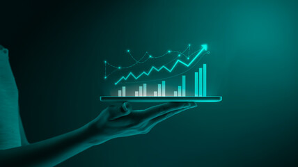 A digital illustration of a hand holding a glowing tablet device against a deep teal gradient background.