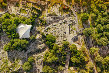 Drone capturing the archaeological site of Troy in Turkiye, highlighting the ancient theater amidst...