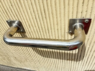 Metal wall grab bar.