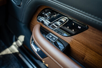 The luxurious cars interior features a stunning control panel that boasts a premium wood finish,...