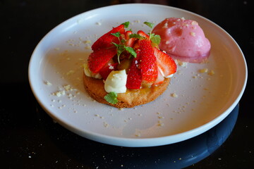 Fresh strawberry tart with berry sorbet