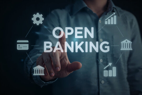 Person touching the words open banking on a digital interface with financial icons