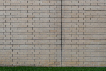 Brick wall with split in between. Missing grout.