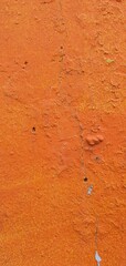 orange wall texture
old orange paint on the wall