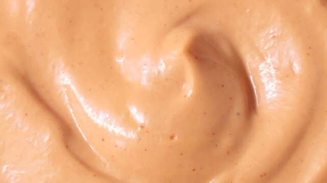 Homemade American burger sauce or thousand island dressing circle rotation close up top view