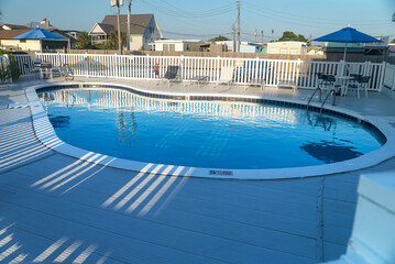 Public pool seating area with clean water and seats