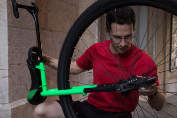 Young unicyclist fine-tuning his apparatus before taking a ride around the city of Palma (Mallorca). © Jaume Rosselló