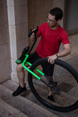 Young unicyclist fine-tuning his apparatus before taking a ride around the city of Palma (Mallorca). © Jaume Rosselló