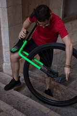 Young unicyclist fine-tuning his apparatus before taking a ride around the city of Palma (Mallorca). © Jaume Rosselló