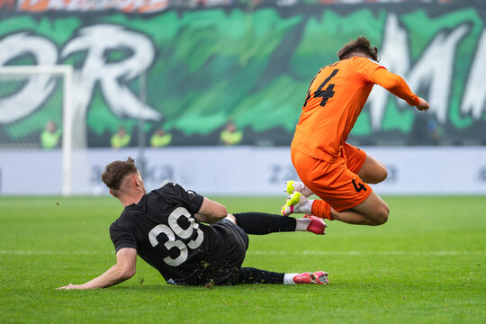 brutal slide tackle and foul during football match.