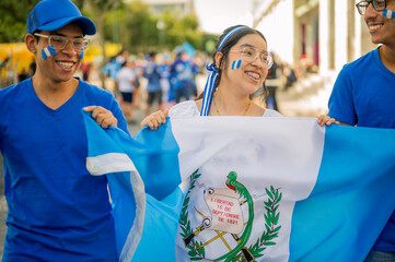 Group of Latino friends celebrating Guatemala's independence celebrations. Close-up.