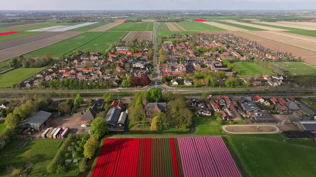 Aerial view of church and floral farmland in Stompetoren, Netherlands