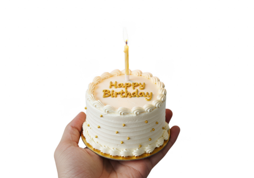 Hand holding a small white birthday cake with a candle and golden happy birthday inscription on transparent background