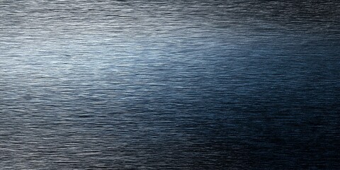 Obraz premium Dark Brushed Metal Texture with Blue Light Gradient – Industrial Surface Background