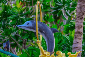 Light pole with a dolphin statue at Sunset Blue hour in Patong in the island of Phuket Thailand 