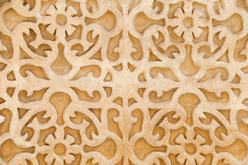 Carved stone wall of historical house in Segovia city