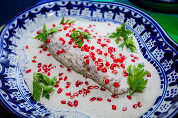 Traditional chile en nogada on Talavera plate
