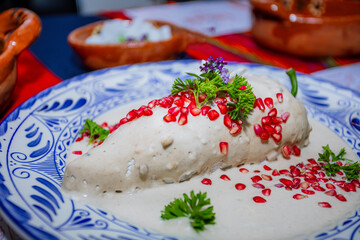 Traditional chile en nogada on Talavera plate
