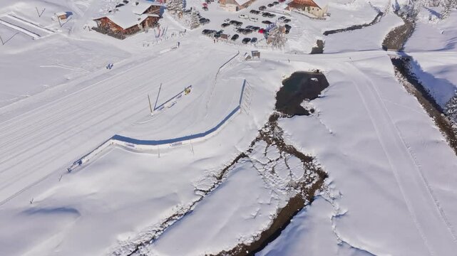 Aerial view of snow-surrounded restaurant on Austria cross-country ski trail