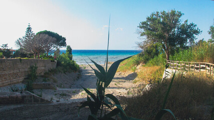 Covered stream leading to the Mediterranean Sea along the Sicilian coast in Italy seen during a...