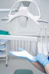 Preparation for Dental Procedures Involving Gloved Hands and Specialized Equipment and Tools