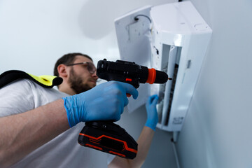 A skilled technician is seen repairing a modern air conditioning system, showcasing the intricate...