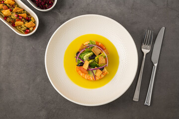 Shrimp on creamy corn soup, topped with tortilla strips, onion and avocado