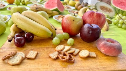 Colorful Summer Fruit and Snack Table Outdoors for a Fresh and Healthy Gathering
