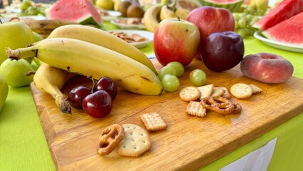 Colorful Summer Fruit and Snack Table Outdoors for a Fresh and Healthy Gathering