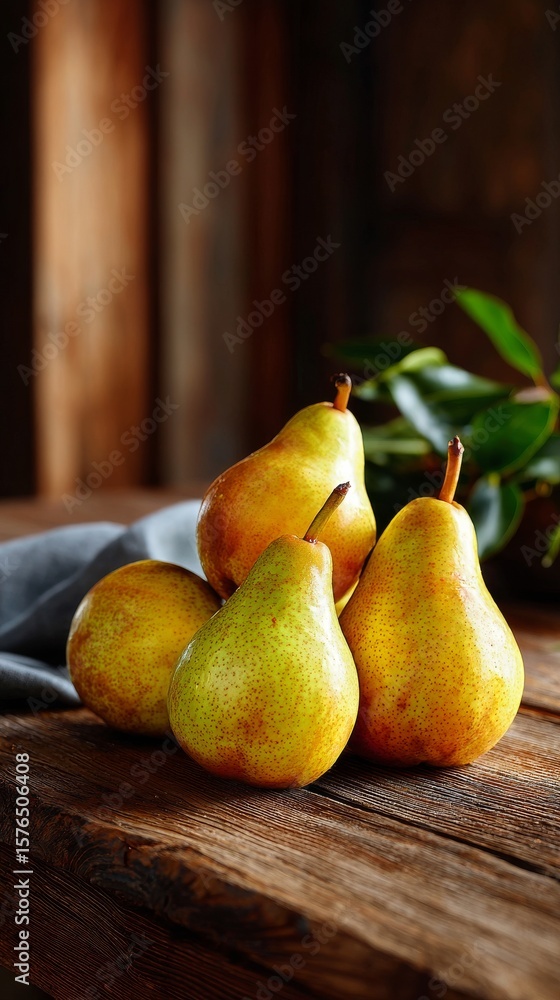 Poster fresh pears arranged on rustic wooden table with soft fabric and greenery in warm lighting