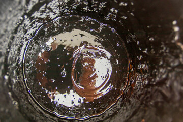Texture of liquid art composition showcasing swirling patterns and contrasting colors in creative abstraction