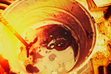 Bubbles forming at the bottom of a glass as water drains away during a warm afternoon in a cozy cafe