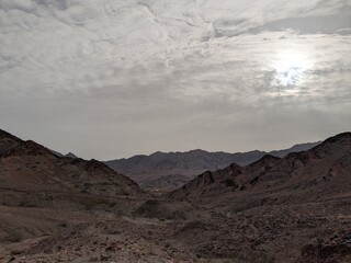 Jordan Trail long distance hiking from Dana Valley to Petra and Wadi Rum.Wadi Rum Desert, Jordan. The red desert and Jabal Al Qattar mountains,Arabia