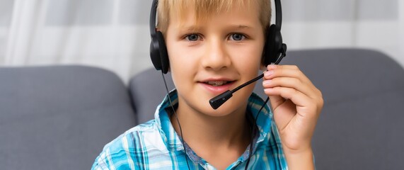portrait of a little boy using a headset