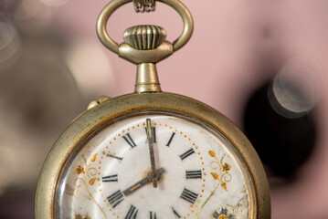 Pocket watch, beautiful and antique pocket watches hanging in front of an abstract background,...
