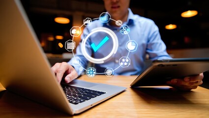 Businessman managing digital tasks with laptop and tablet, Modern technology integration for streamlined business processes
