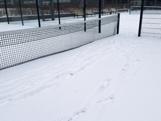 winter padel tennis court full of snow