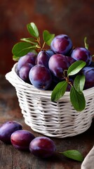 Freshly Harvested Plums in a Rustic White Basket on a Wooden Surface