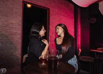 couple in love sitting in a bar drinking beer