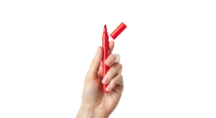 A hand holding a red marker with the cap off against a black background in a studio shot style
