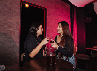 couple in love sitting in a bar drinking beer