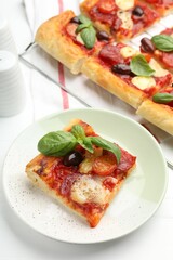 Tasty homemade pizza on white table, above view