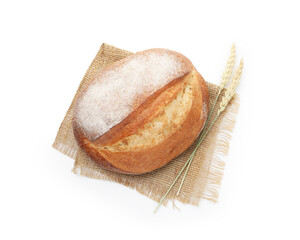 Loaf of fresh bread and spikes isolated on white, top view