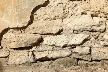 Texture of old stone wall as background, closeup