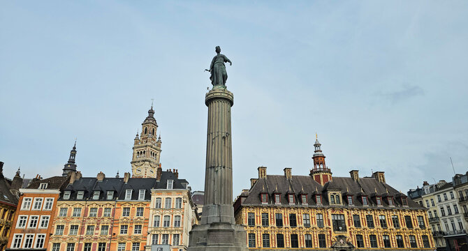 Lille cityscape, La Grand Place square in city center, Flemish mannerist architecture style buildings, Column of Goddess and bell tower Chamber of Commerce in Lille, France