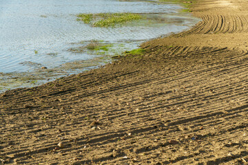Draining the lake before cleaning. Environmental disaster, pollution of the reservoir and fresh...