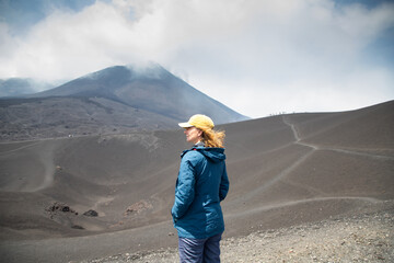 hiker trekking on mount Etna