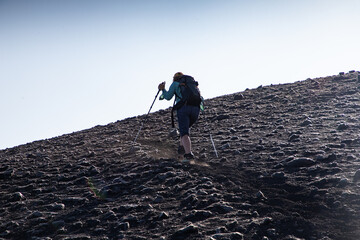 hiker trekking on mount Etna