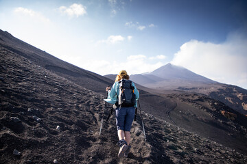 hiker trekking on mount Etna