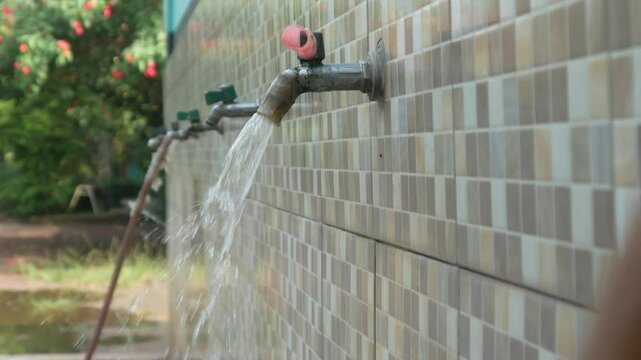 water flowing from the tap in the ablution area